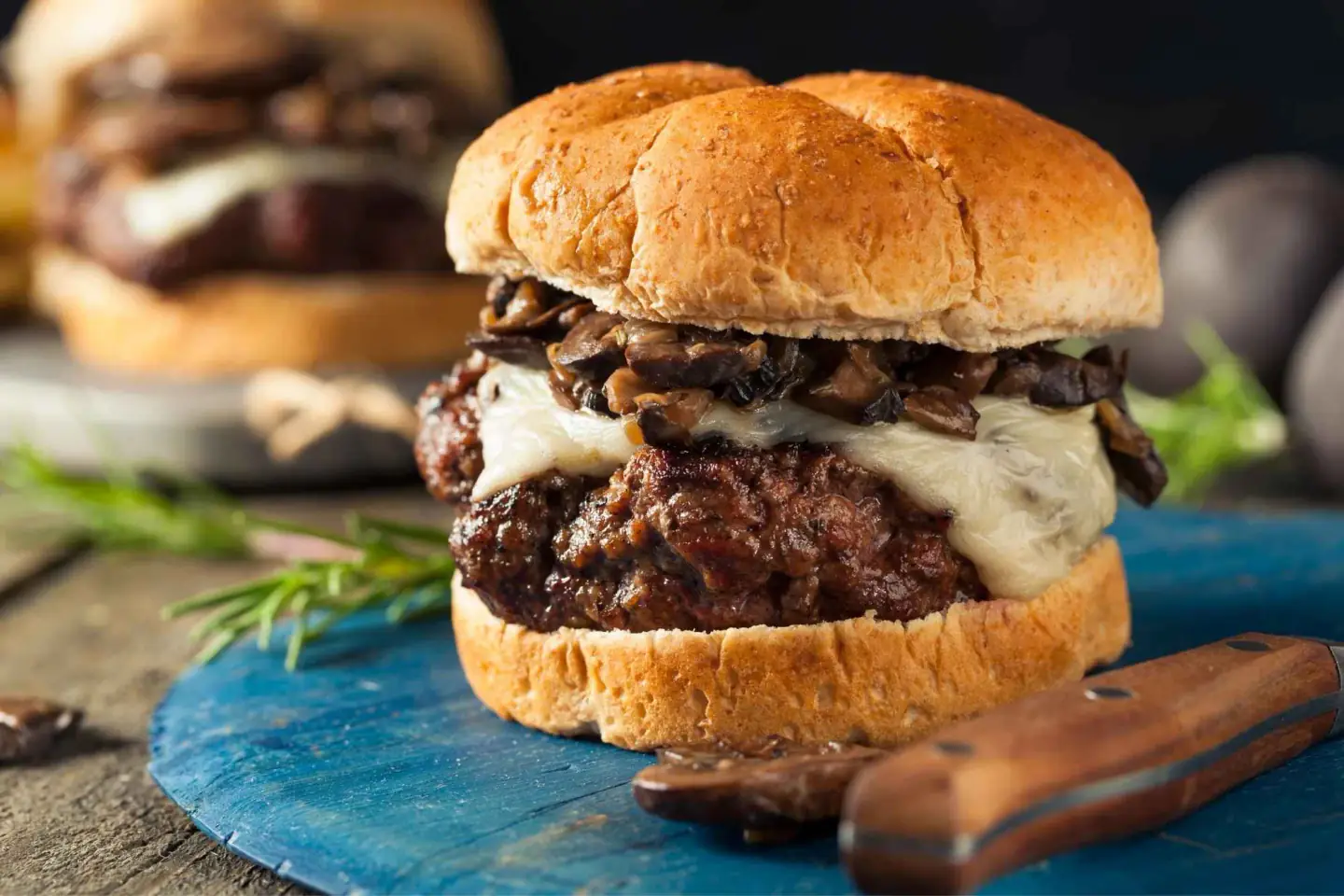 Black Burger smash-style burger with melted cheese and sautéed mushrooms